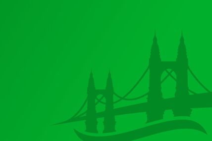  A vibrant green backdrop showcasing a bridge at the centre